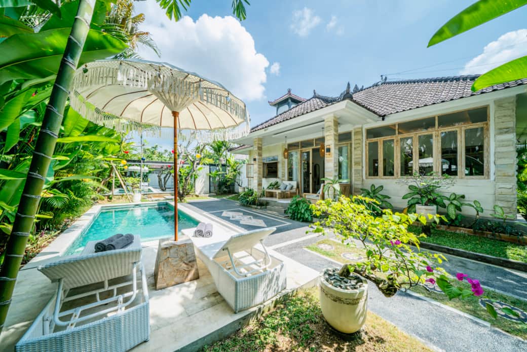 Sparkling private pool framed by lush gardens in our Seminyak luxury 3-bedroom villa