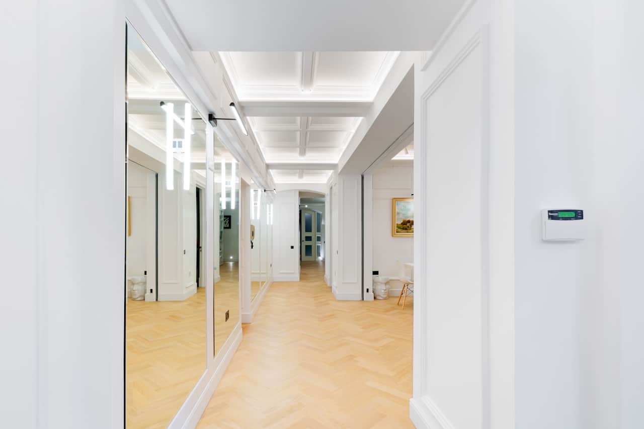 Bright herringbone hallway leading through to the rest of the flat