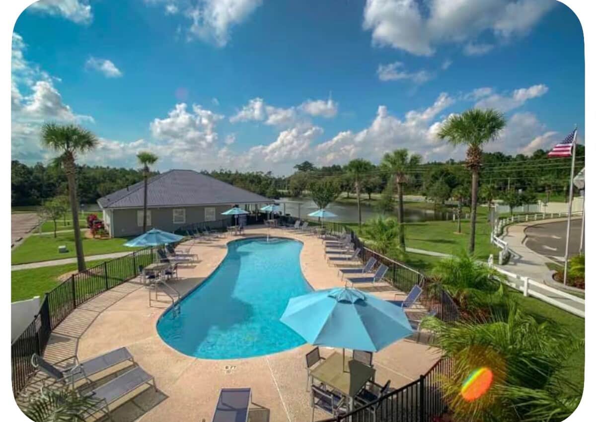 Soak up the Florida sunshine at a shared Pecan Park RV Resort swimming pool.
