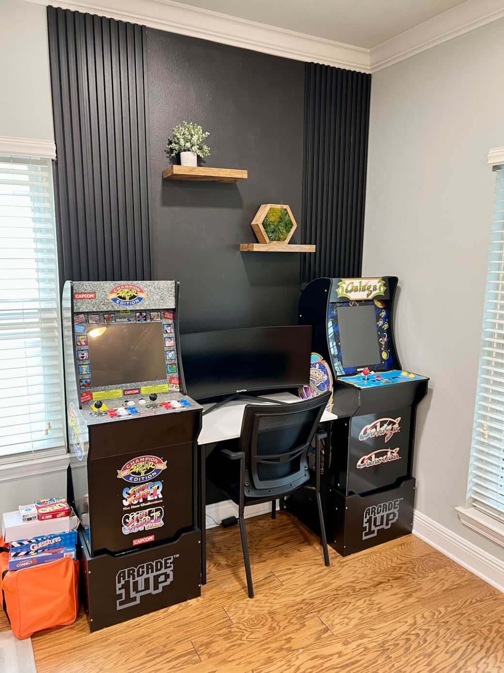 Two arcade games with a workstation