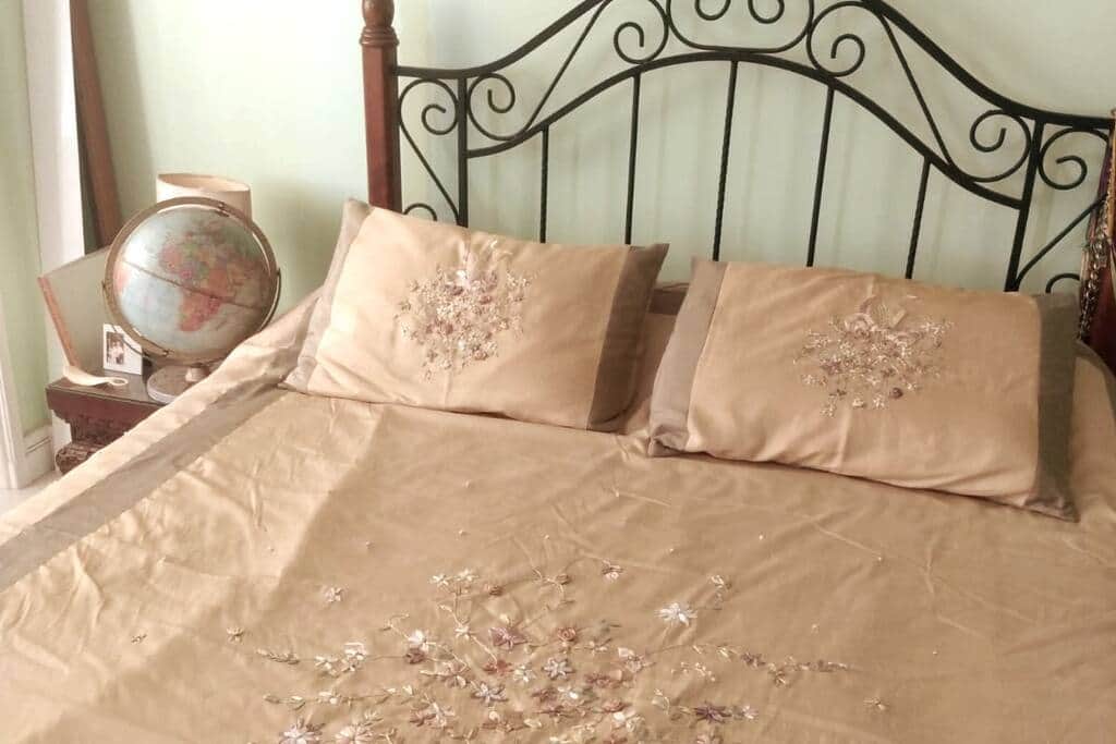 Queens-size bed with European mattress