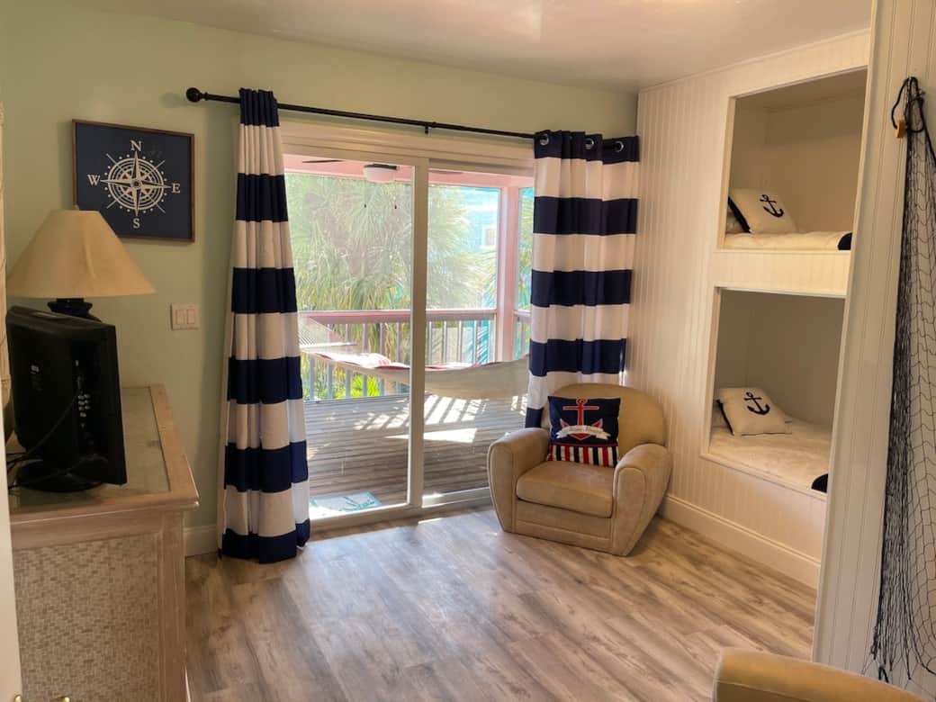 Bunk room. Entrance to screened porch area. We also added Roku for the tv and a classics gaming system.