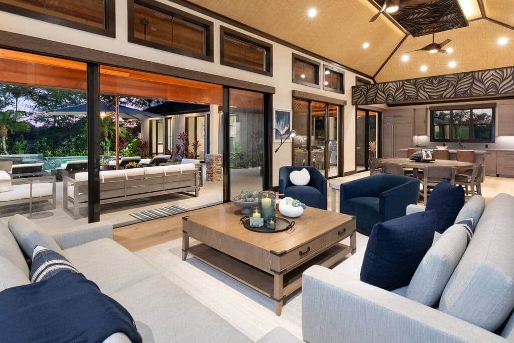 Expansive living space with open air views of the pool