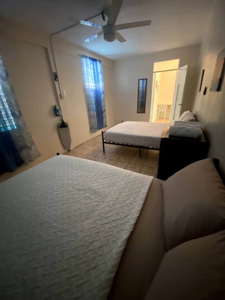 1 bedroom with two full beds for up to 4 people. Bedroom is equipped with an 18,000 Inverter Air Conditioned.