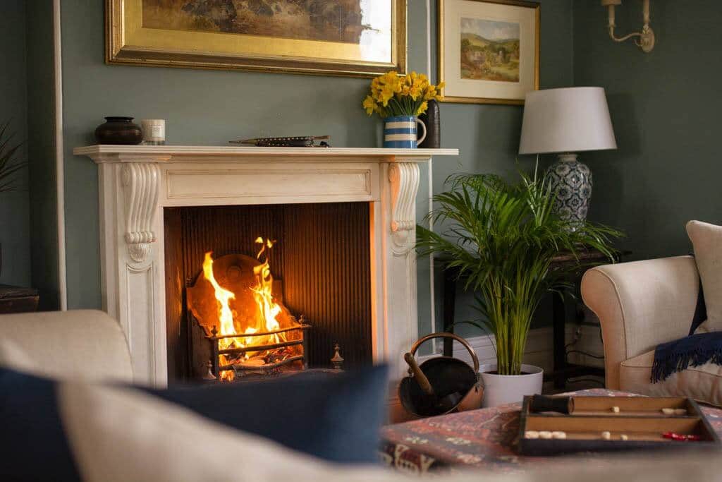 Sit by the open fire in the sitting room and relax