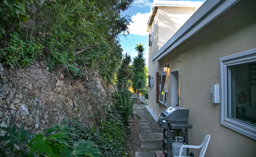Back entryway with outdoor grill and laundry room