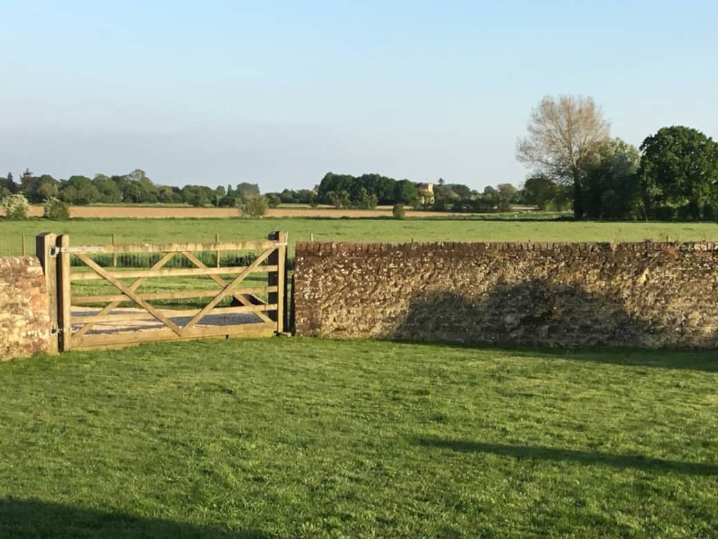 The view from the kitchen and patio of the garden and beyond