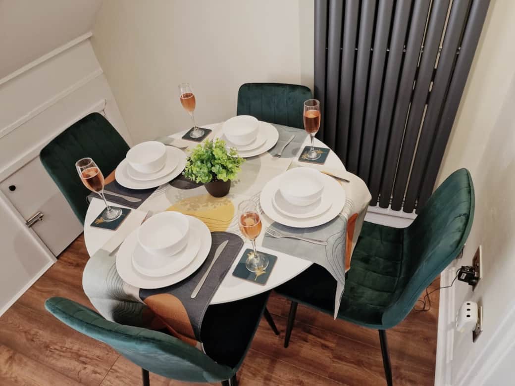 Dining area seating four guests.
