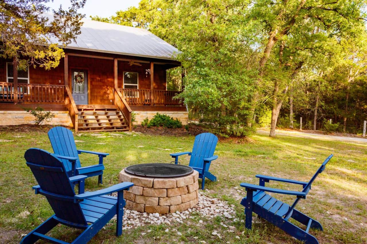 Front yard with firepit and supplied firewood and starters
