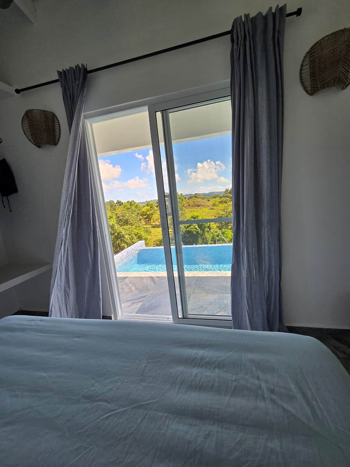 La Casita Blanca bedroom opening toward the pool