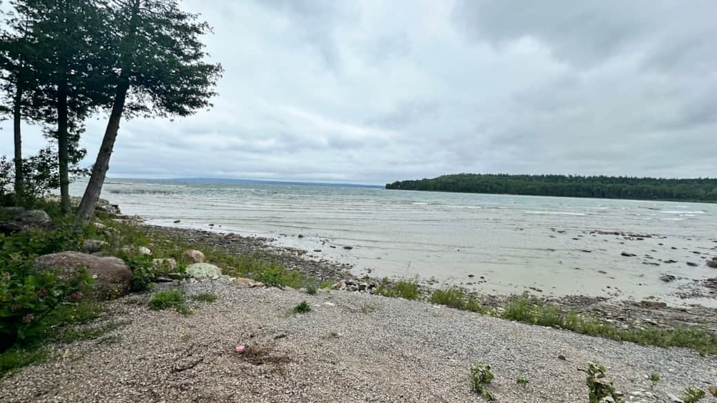 Rocky/sandy shoreline with very safe slope for kids