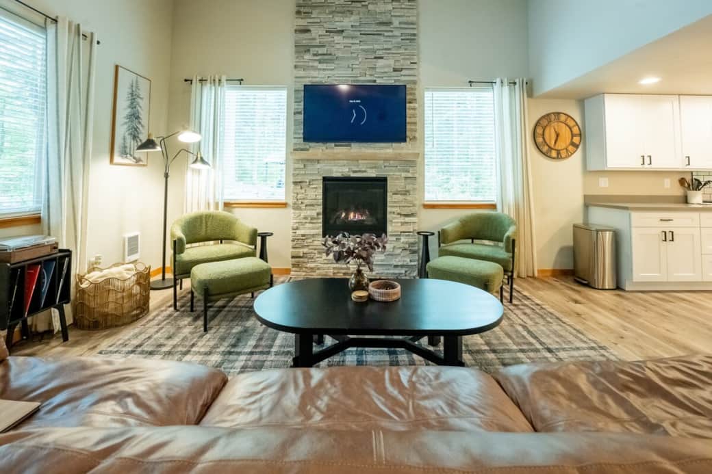 Relax by the fireplace and enjoy the cozy comforts of our main living room
