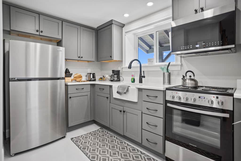 Efficiency kitchen, coffee pot with basket filter, shared BBQ outdoors. 