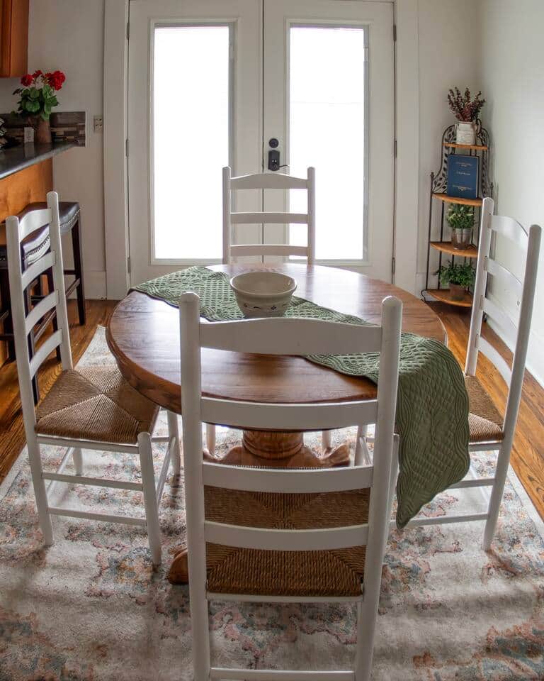 There is an extension leaf for the table and extra chairs around the house allowing up to 8 people to dine at the table. There is also a card table with four chairs and two stools at the kitchen bar. 