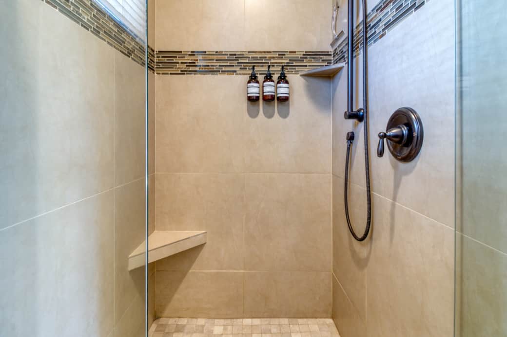 Primary suite walk-in tiled shower