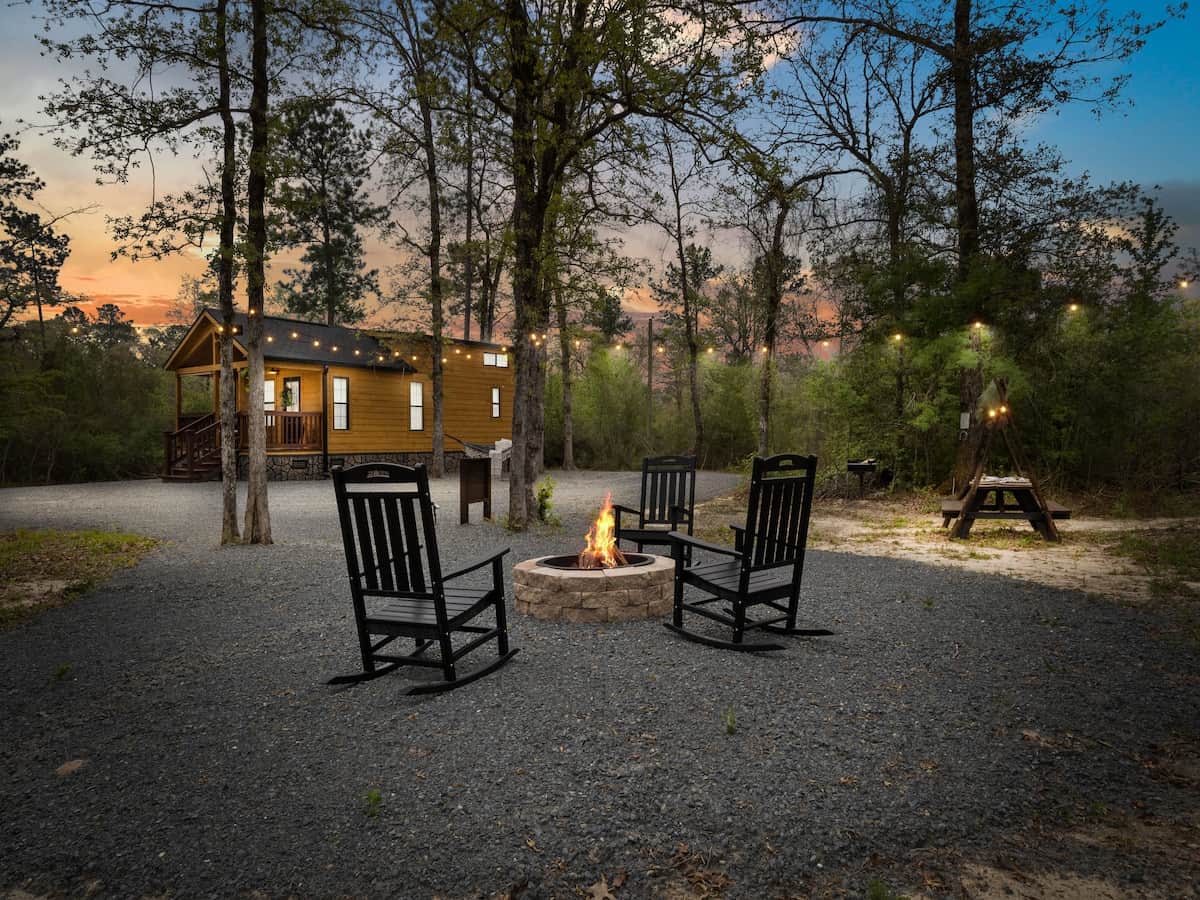Deer Ridge Run is a custom, rustic cabin nestled away in the woods. Deer Ridge Run will welcome you with a fire pit area, hammock, horseshoes, and a nature-inspired, pic-nic table.