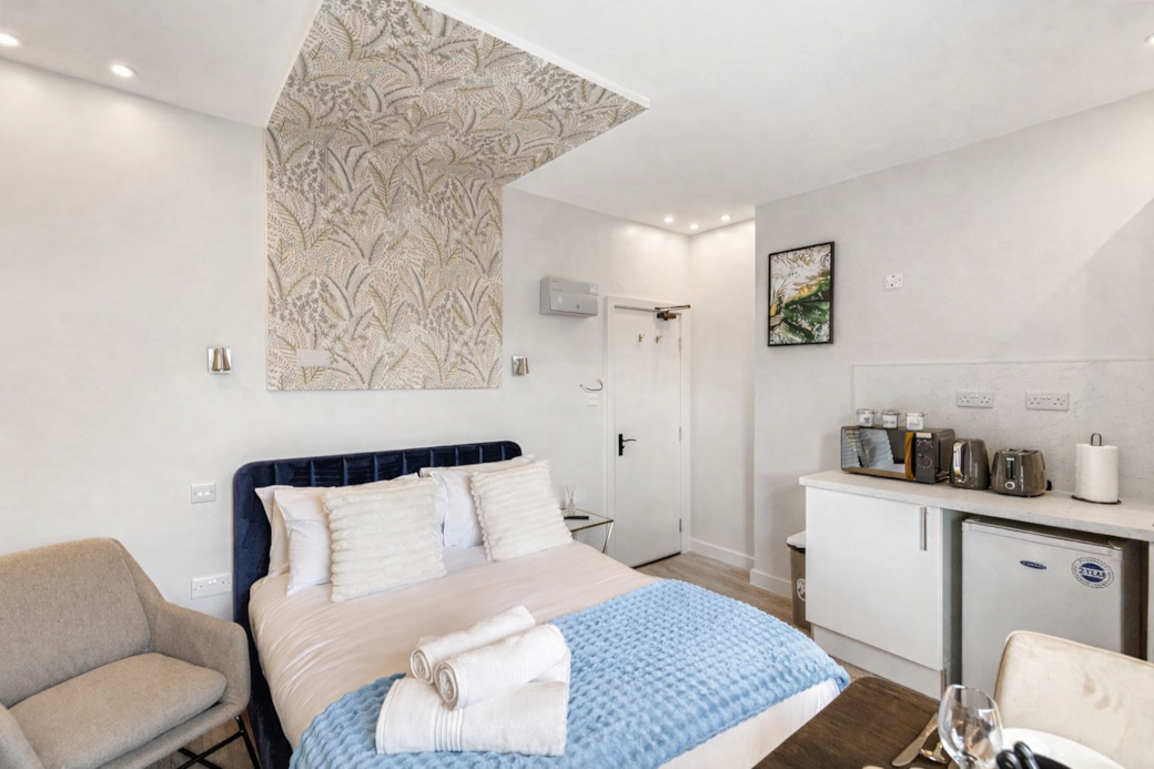 right and stylish bedroom featuring a plush double bed with luxury linens, right and stylish bedroom featuring a plush double bed with luxury linens,
