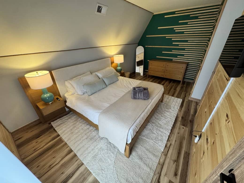 Bedroom 1 - Enjoy a large king bed to sprawl out and enjoy your time relaxing in the mountains!
