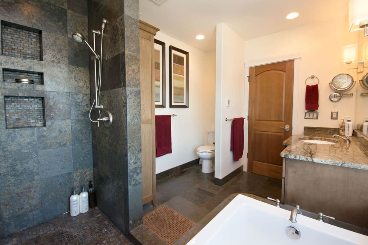 Master bathroom with soaking tub, walk in shower, with lots of natural stone. Luxury spa vibes! 
