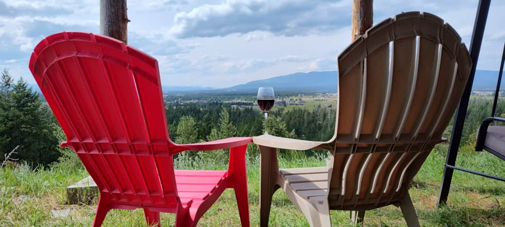 Outdoor sitting area and valley view by day