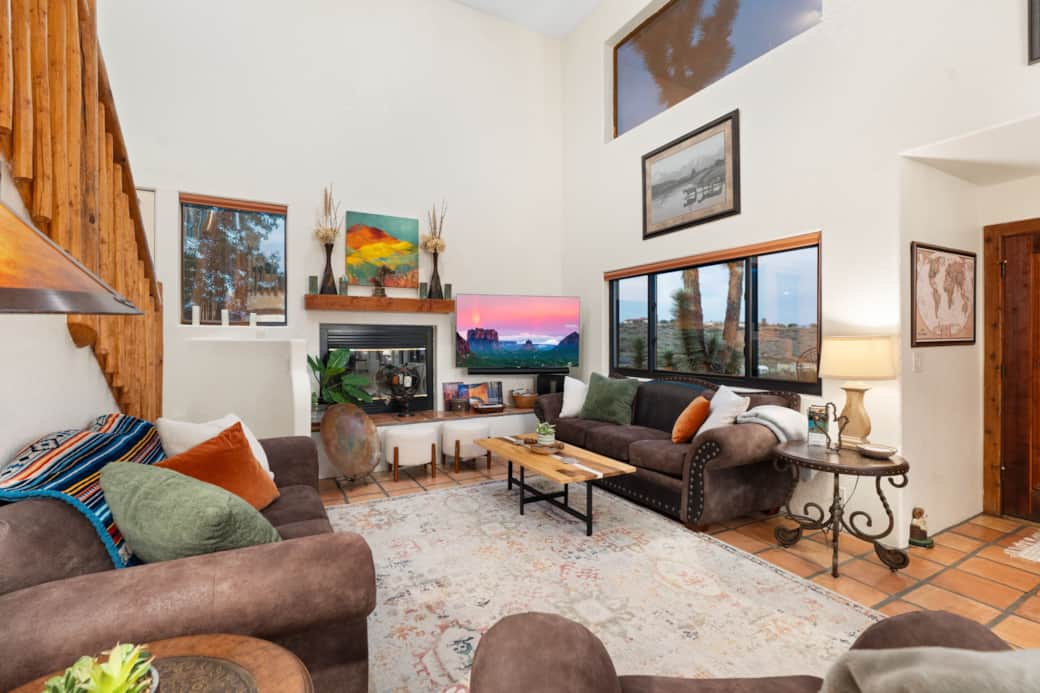 Kick your feet up in this living room and watch your favorite show on the smart TV