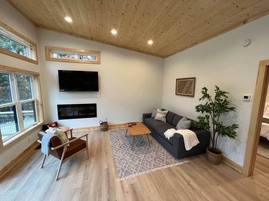 Cozy up by the electric fireplace with a book or lounge on the couch watching your favorite series