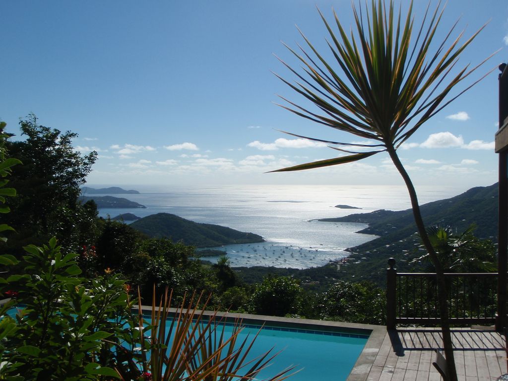 Sunny pool deck overlooking Coral Bay