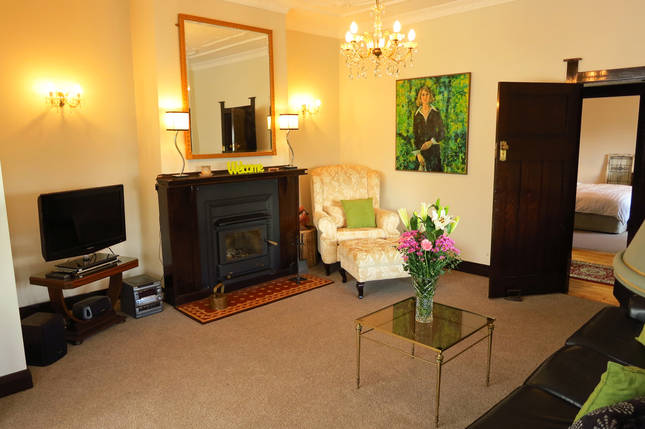 Living room with slow combustion wood heater