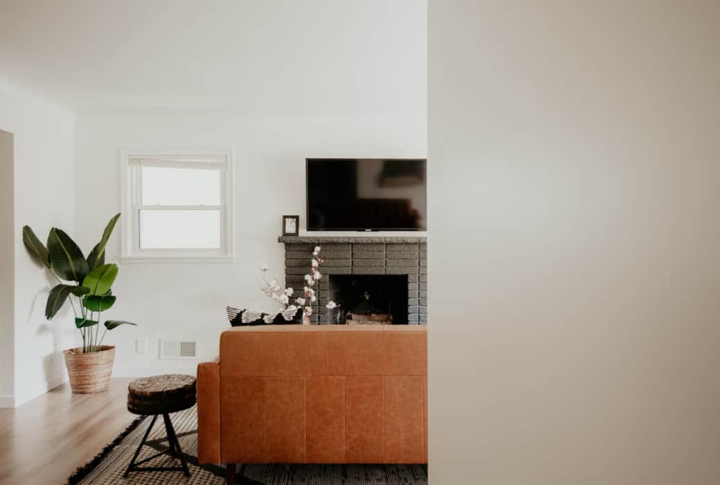 Living room with smart tv and leather couch