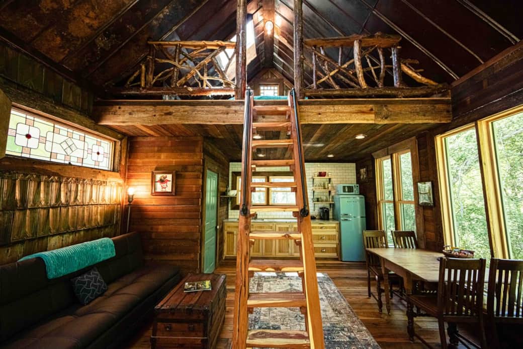 Our cabin is not big but has big lodge energy and loads of reclaimed architecturals.  We took a lot of care to celebrate our woodsy surrounding.  The cedar railings on the porch and in the loft are from the land.  