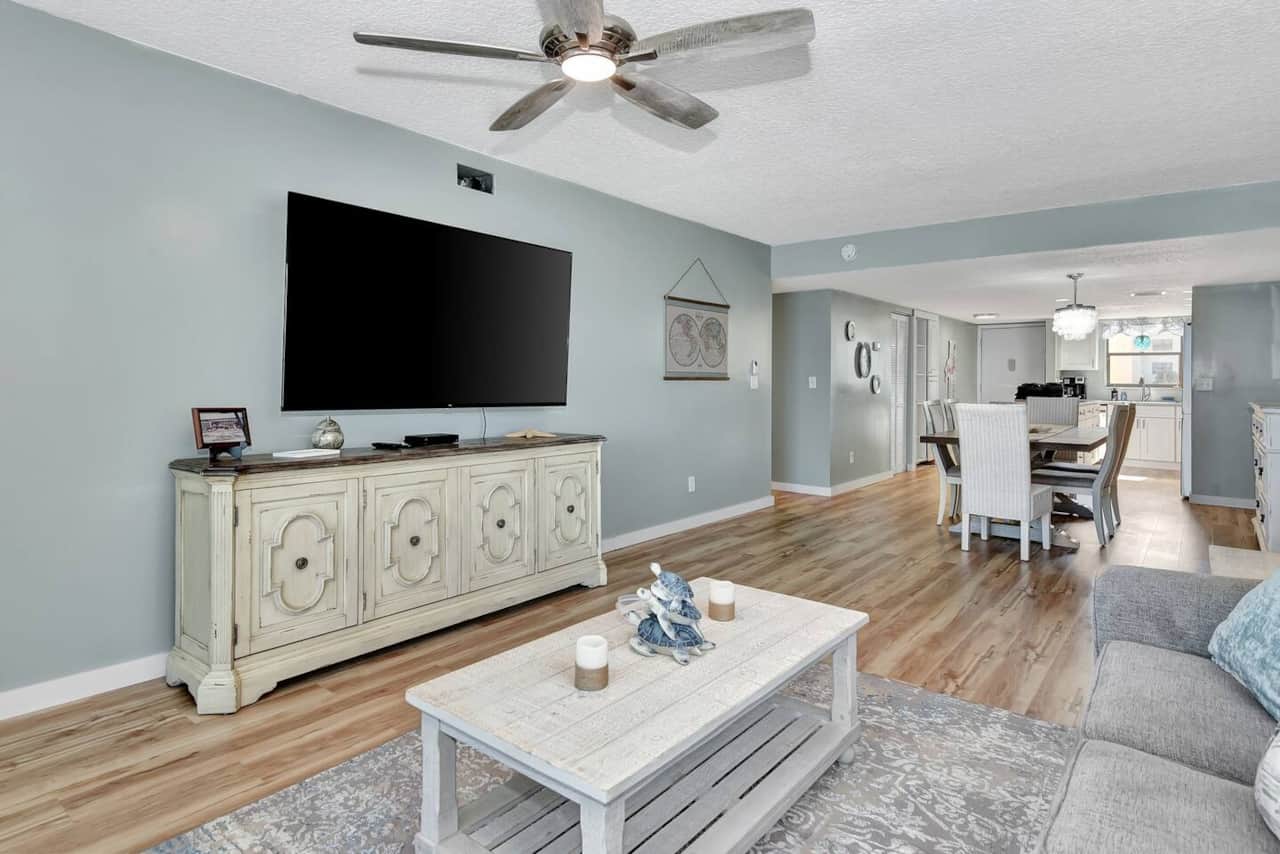 Living room leading to kitchen and dining 