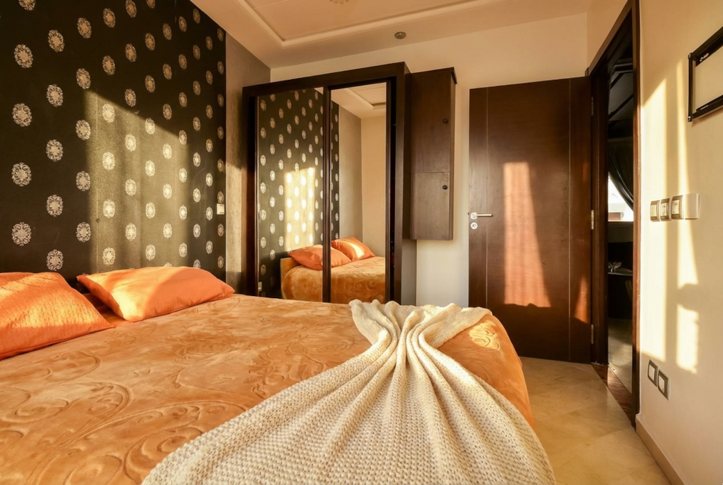 Cozy Bedroom with Bold Wallpaper