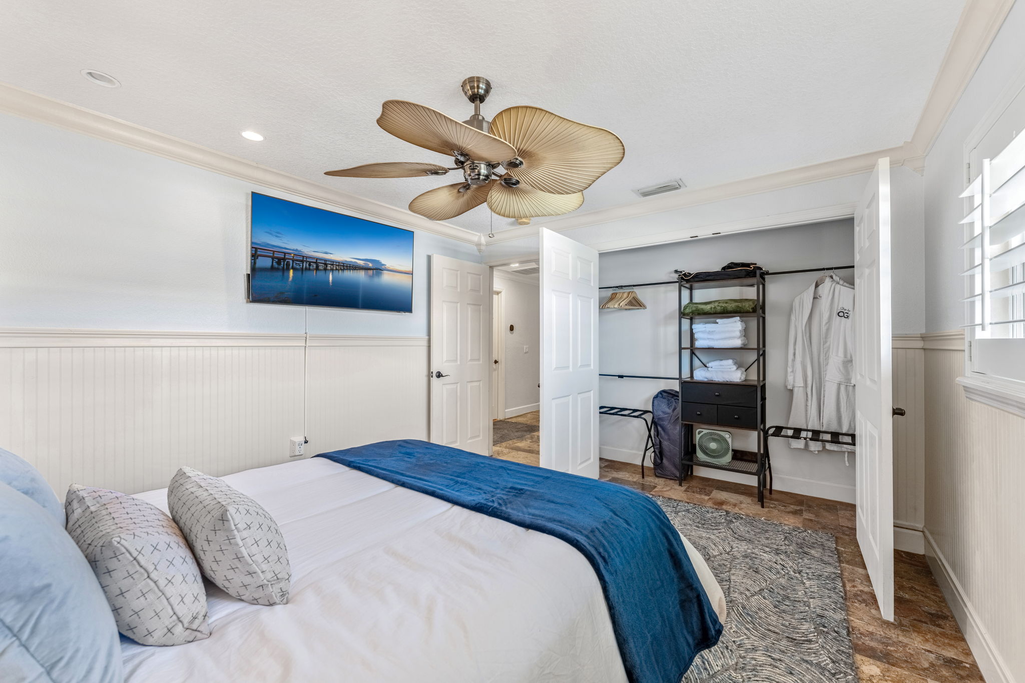 Bedroom 3, designed for comfort with an ample closet space and a TV.