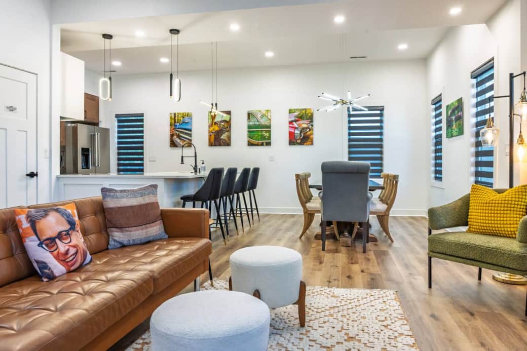 Open concept main floor with plenty of windows with roller shades allowing you to customize the amount of light vs. privacy. Enjoy one-of-a-kind photography throughout the home, created by the host.