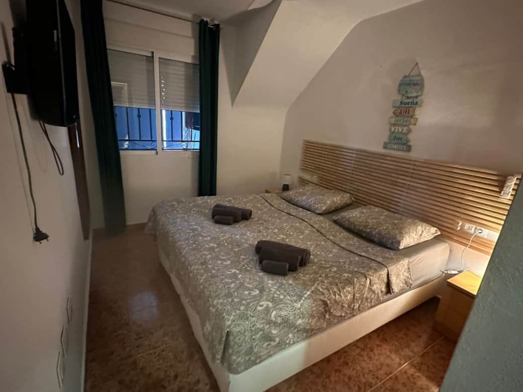 King-size bed with mattress topper