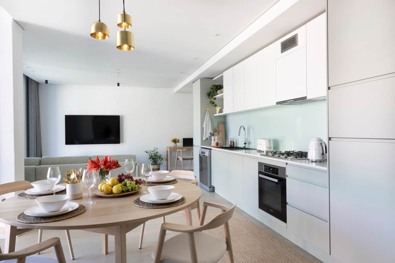 Spacious living area with locally crafted dining table by James Mudge