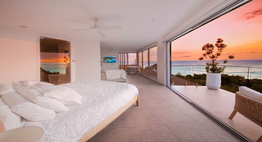 Wake to panoramic ocean views from your luxury king bed — a romantic Coolum Beach escape.