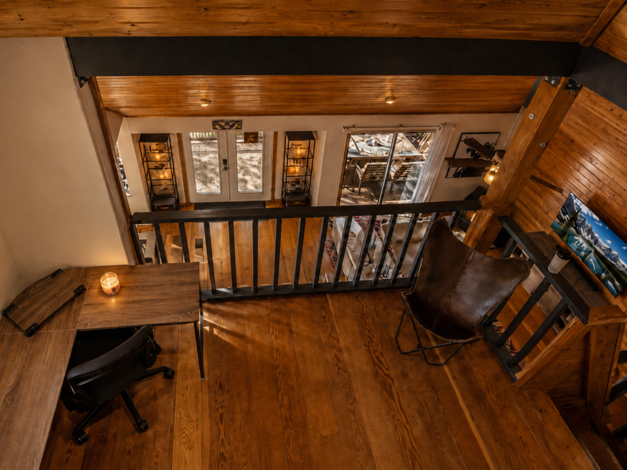 Dedicated workspace in loft with forest views