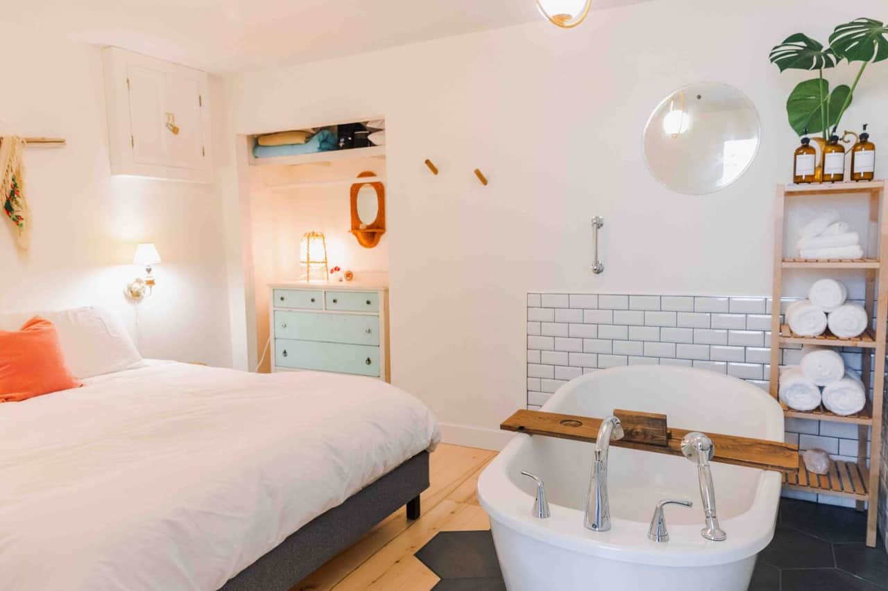 Luxurious deep soaker tub located in the bedroom