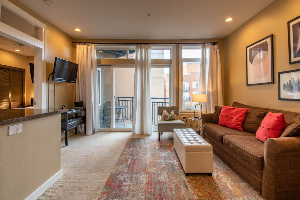 Living Room with a  Private Balcony Overlooking the Courtyard Garden 