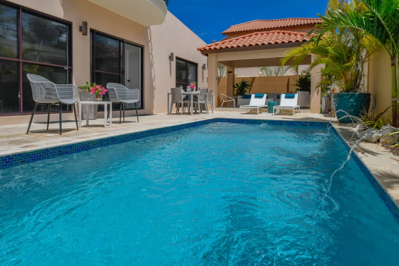 Private backyard with dining and lounging areas, exclusively for your use