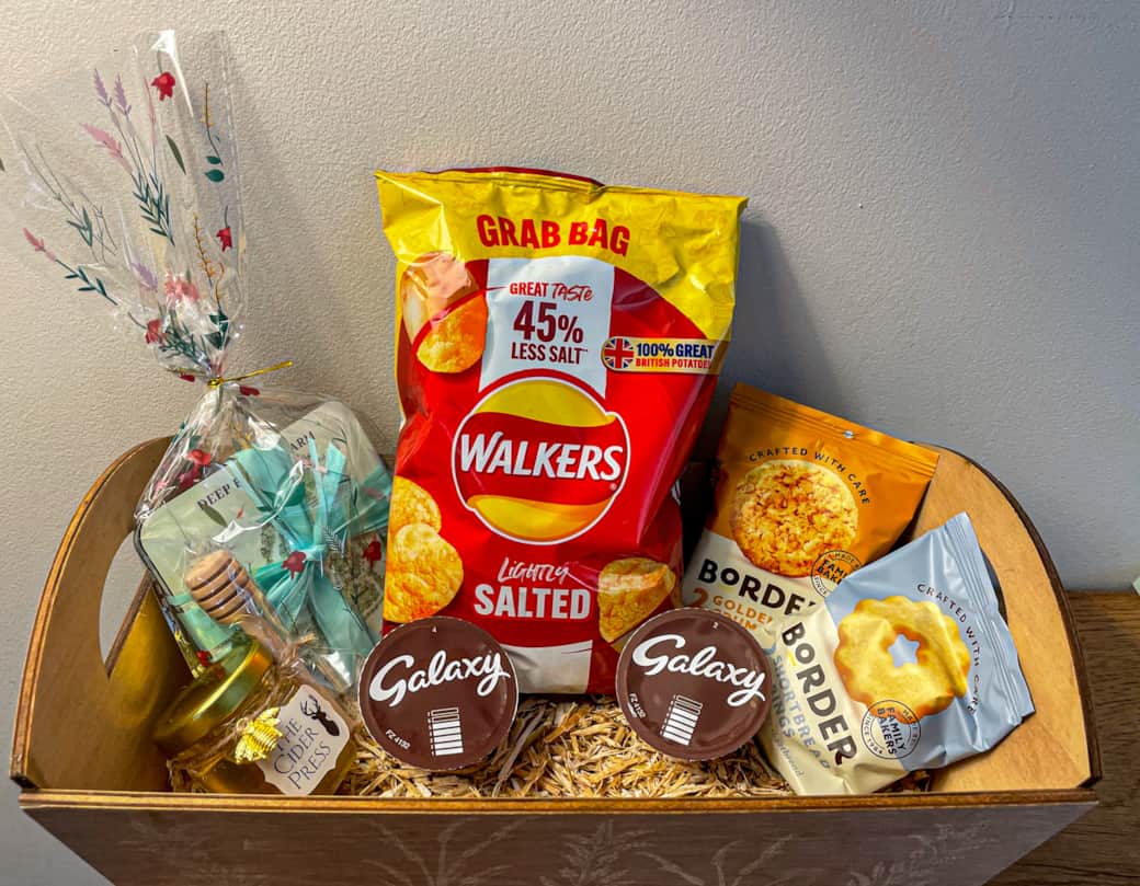 Guest Welcome basket, hot chocolate, biscuits, potato crisps, local honey and a souvenir gift