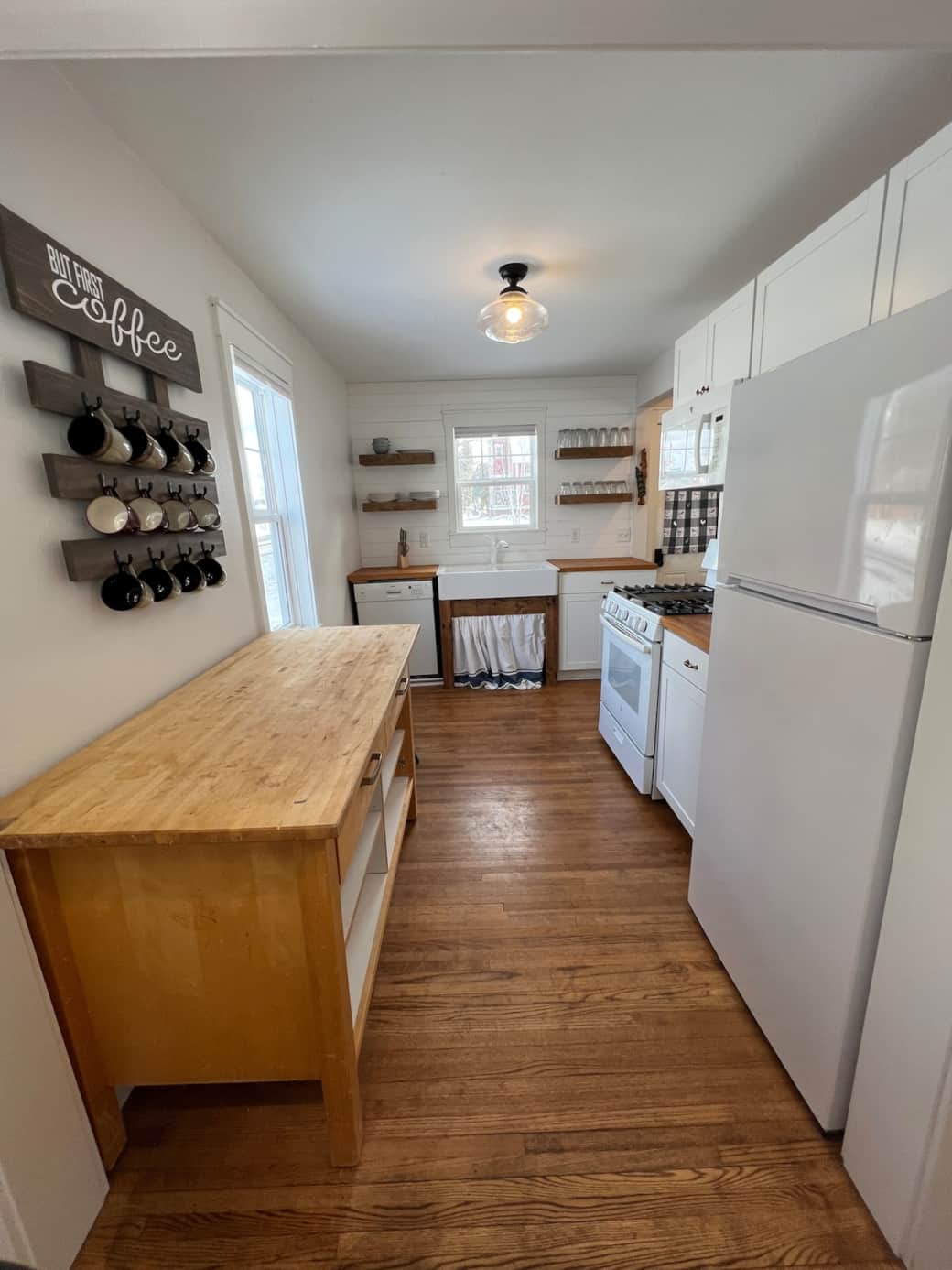 Cute farmhouse kitchen fully stocked with dishes, pots/pans and coffee/tea/cocoa station