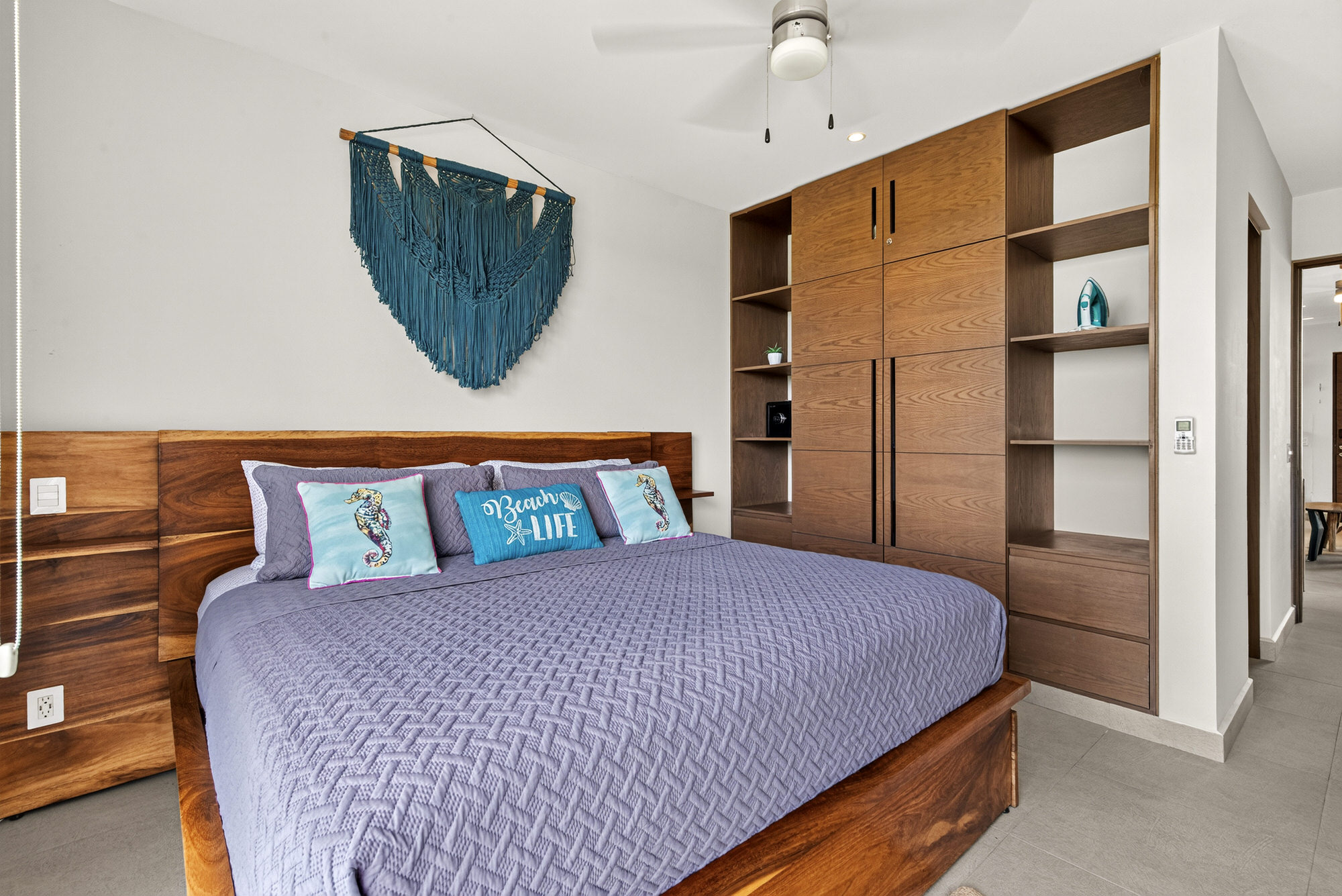 Main bedroom with king bed, smart TV, full wardrobe, secure safe, and a private en-suite bathroom.