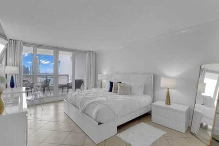 Master bedroom suite, king bed, balcony access, desk, Roku tv, walk in closet, master bathroom