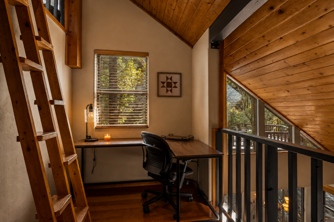 Loft workspace with forest views at Jag Cabin, a Munds Park cabin near Flagstaff