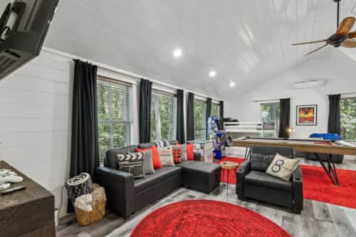 Spacious living area with board games console and gas fireplace