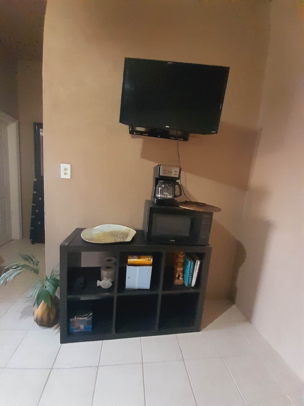 Smart TV, coffee maker, and mini fridge