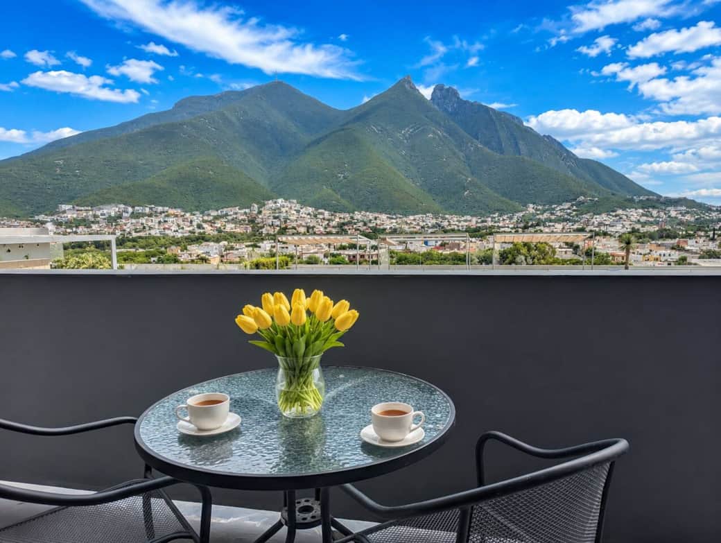 Charming private balcony with a bistro table, all set against stunning mountain views. A peaceful spot to relax, sip a warm drink, and enjoy Monterrey’s iconic scenery. Charming private balcony with a bistro table, all set against stunning mountain views. A peaceful spot to relax, sip a warm drink, and enjoy Monterrey’s iconic scenery.