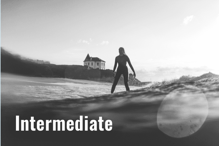 The picture shows a surfer in a surf school at Baleal Peniche Portugal